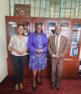 Judith Akoth the director Nursing and Midwifery services (centre) with Ms Betty Muchiri and Mr Solomon Kibue from Pathways Policy Institute (PPI) posing for a photo after a consultative meeting held recently at Afya House, Nairobi.